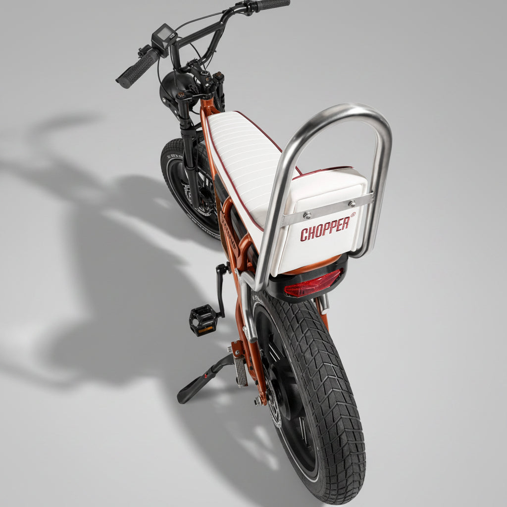 Chopper-style electric bike on a gray background